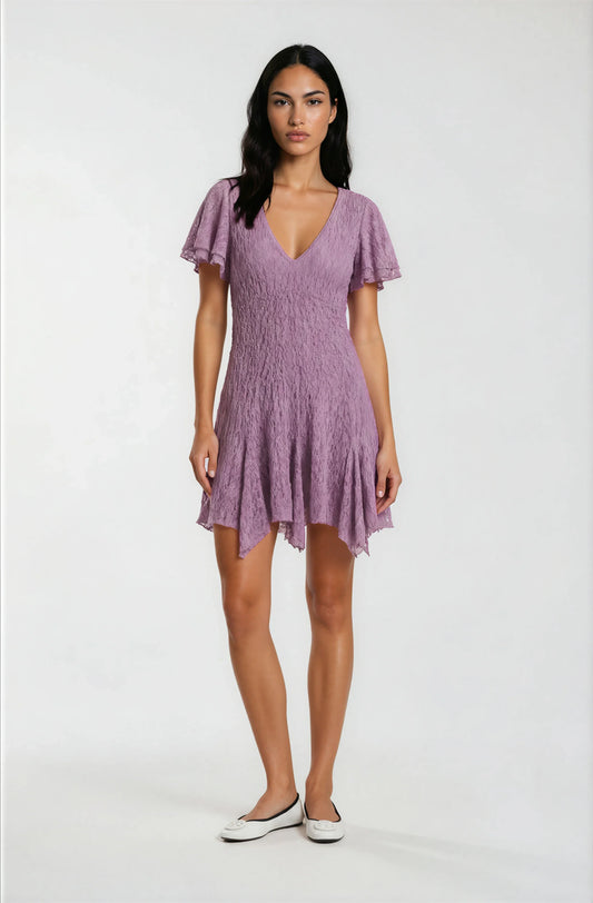 Woman wearing a purple dress on a white background