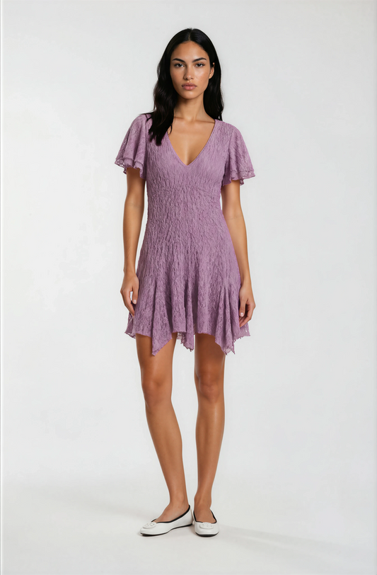 Woman wearing a purple dress on a white background