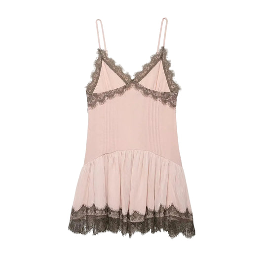 Pink spring women's slip dress with brown lace details on a white background