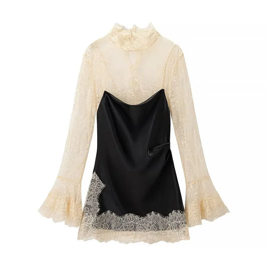 Two-tone dress with lace sleeves and hem on a white background