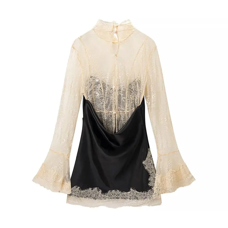 Back of Black dress with lace detailing on a white background