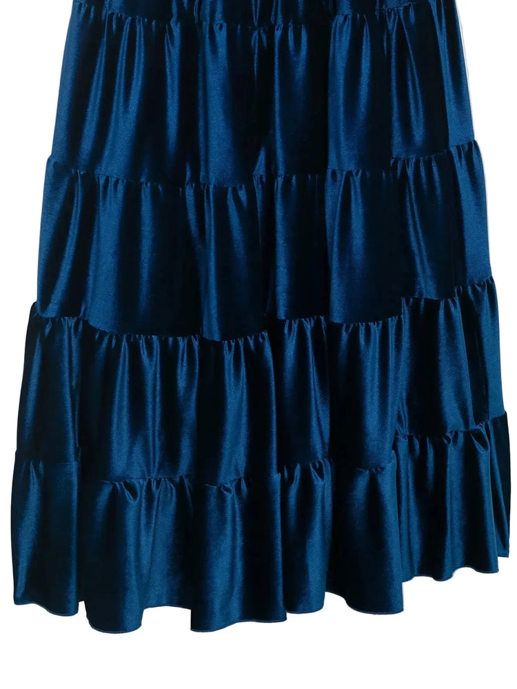 close up of Blue tiered pleated sleeveless women's dress on a white background