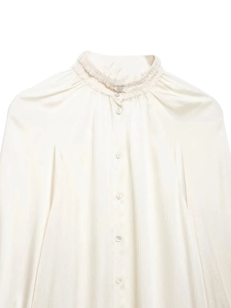 White blouse with a high collar on a white background