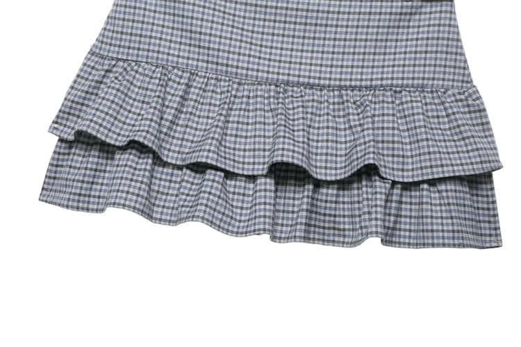 Plaid skirt with ruffled layers on a white background