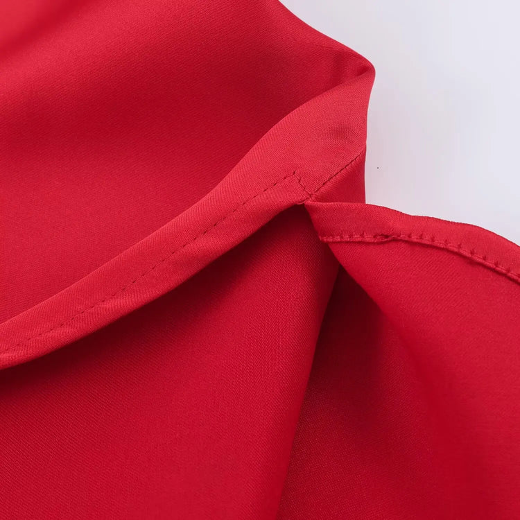 Close-up of red fabric with a white background