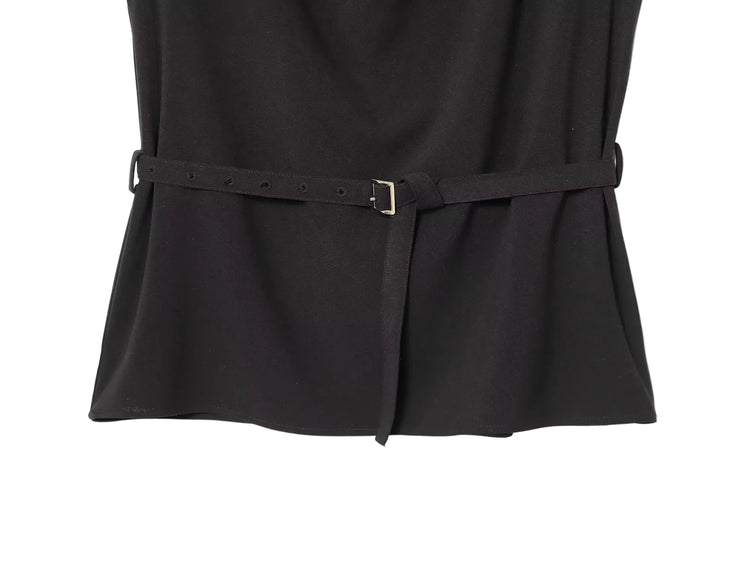 Black sleeveless women's dress top with a belt on a white background close up