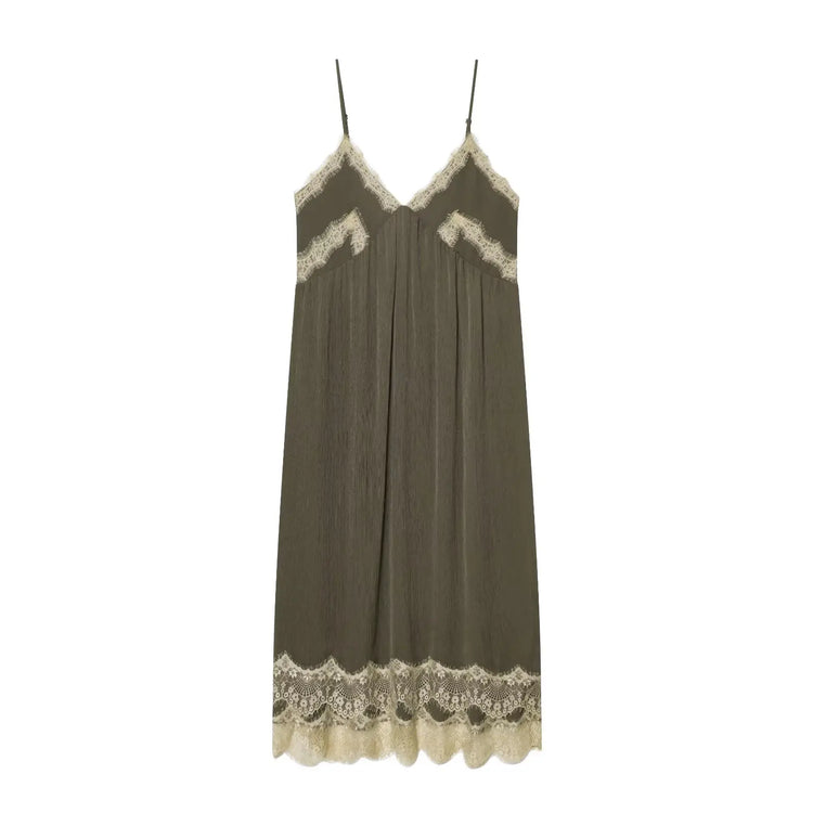 Green slip dress with lace trim on a white background