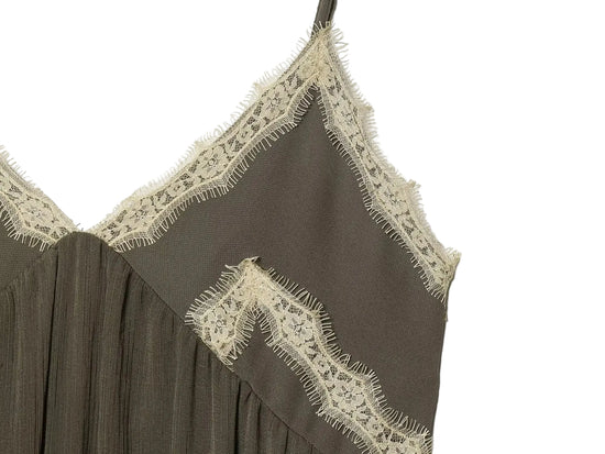 Green Brown dress with lace detailing on a white background