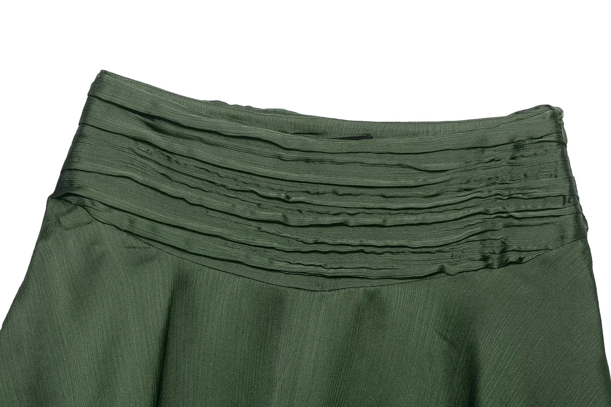 Green  women's skirt with ruffled layers on a white background Spring close up