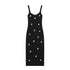 Black women's sleeveless dress with white floral patterns for Spring on a white background