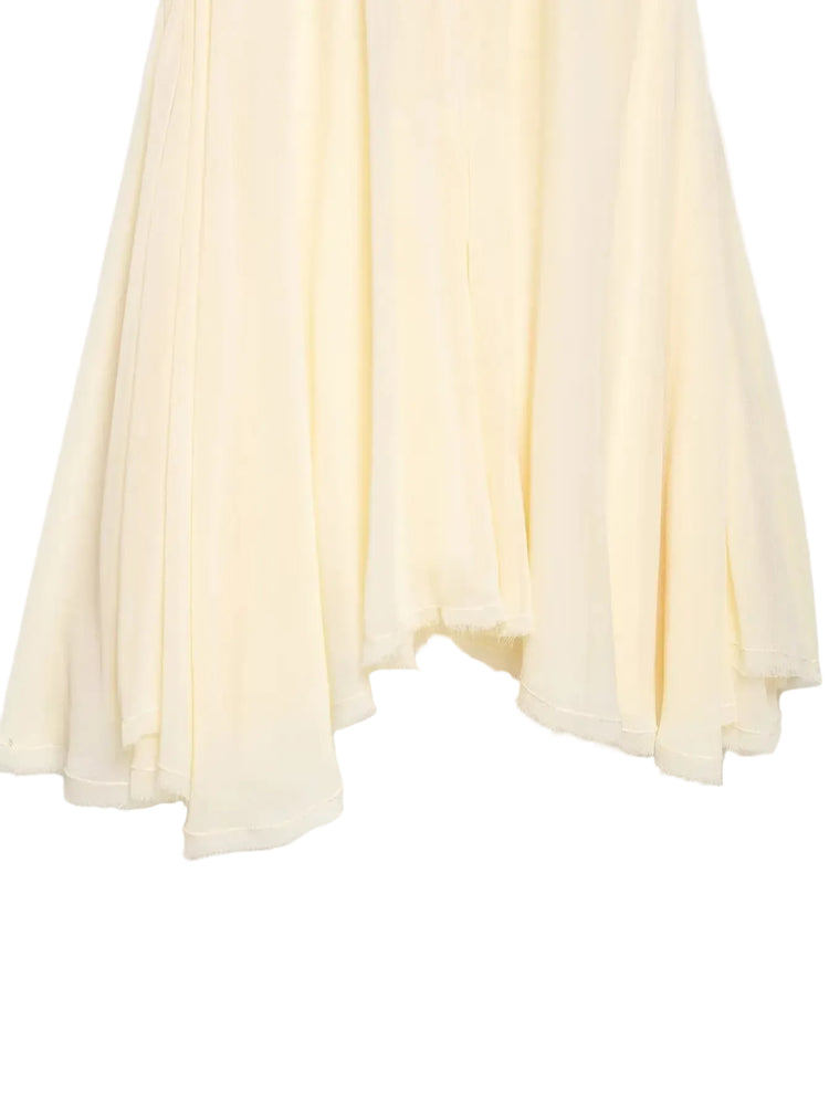Beige pleated fabric on a white background