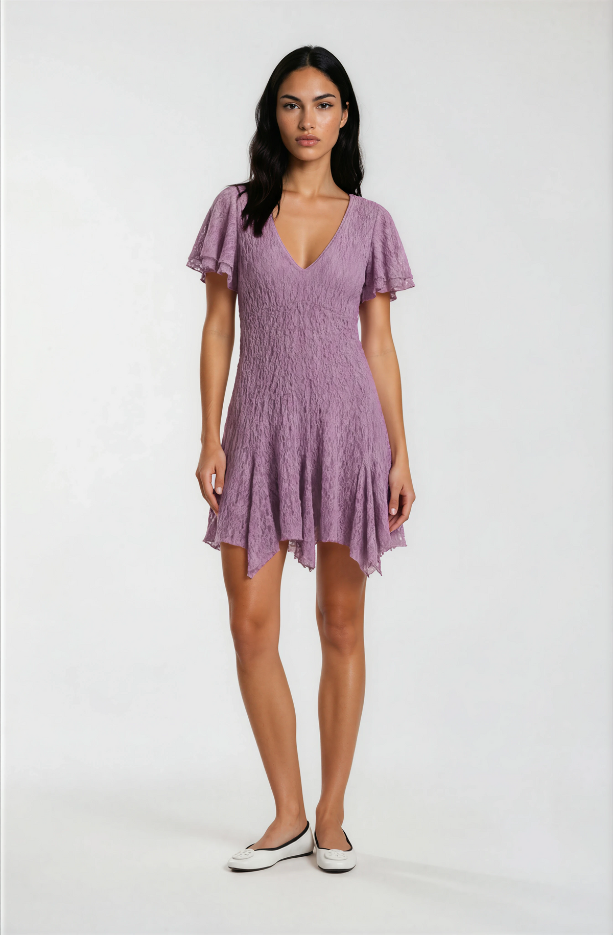Woman wearing a purple dress on a white background