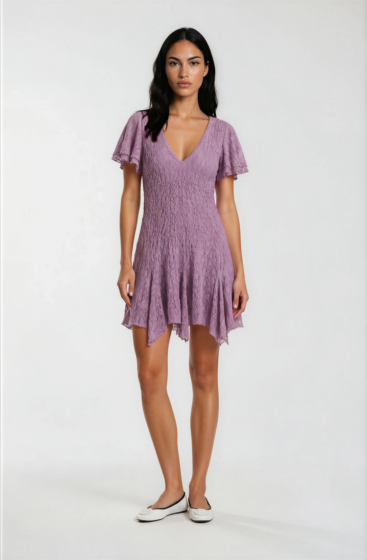 Woman wearing a purple dress on a white background