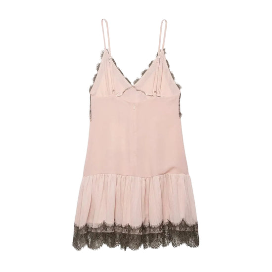 Pink slip dress with lace trim on a white background