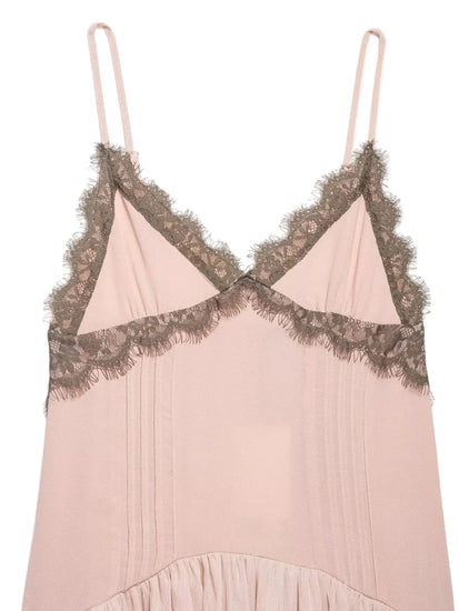 Pink slip dress with lace detailing on a light white background