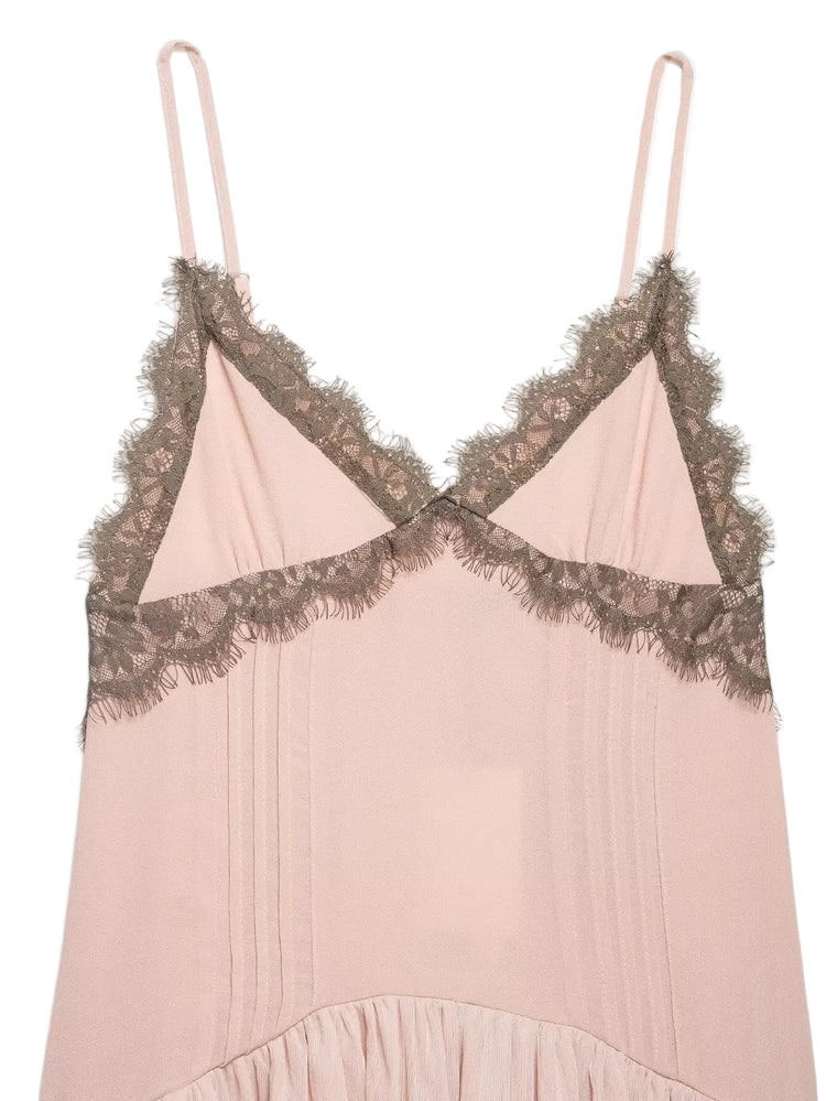 Pink slip dress with lace detailing on a light white background