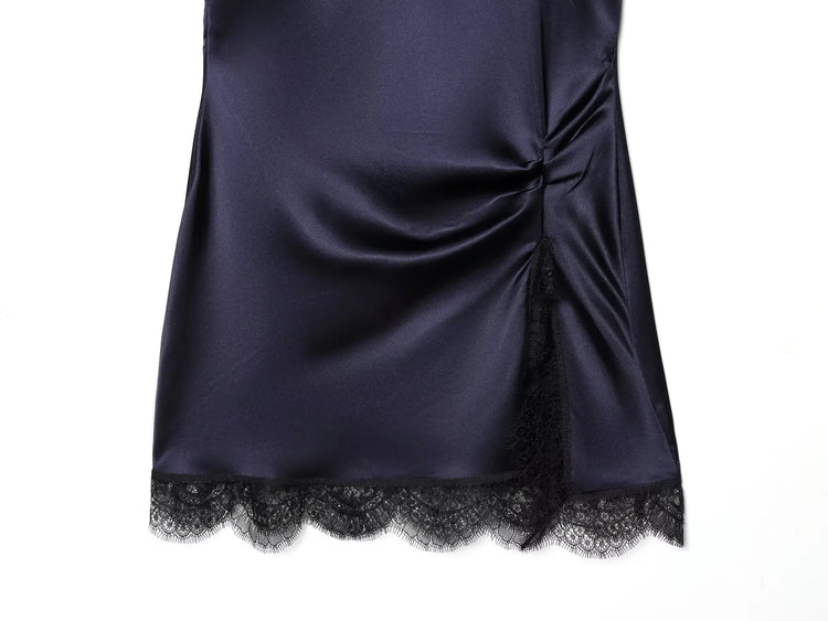 Navy satin dress with black lace trim on a white background