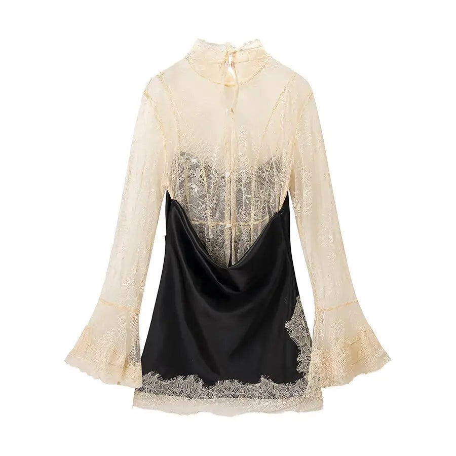 Back of Black dress with lace detailing on a white background