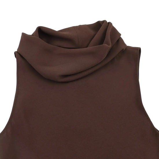 Brown sleeveless top close up on a white background
