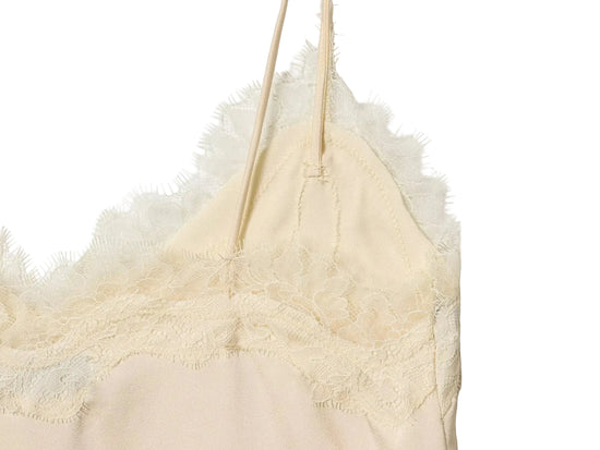 Cream-colored lace-trimmed camisole tank top close up