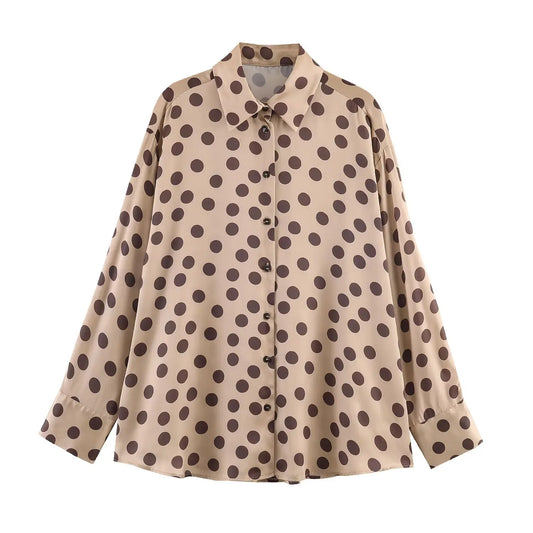 Beige shirt with brown polka dot pattern on a white background