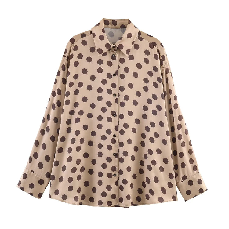Beige shirt with brown polka dot pattern on a white background