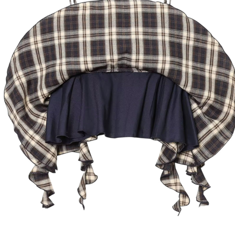 Plaid bonnet with navy blue ruffle on a white background