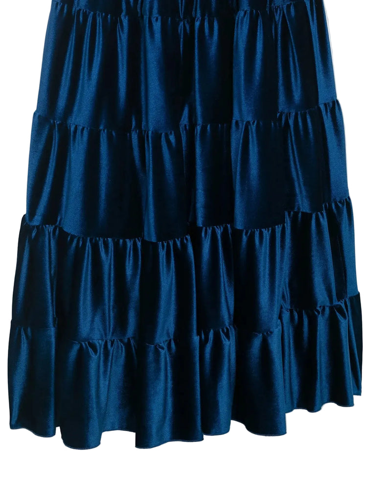 close up of Blue tiered pleated  sleeveless women's dress on a white background