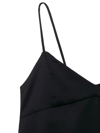 Black top with thin straps on a white background