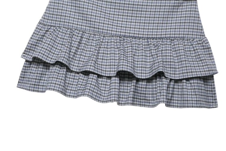 Plaid skirt with ruffled layers on a white background