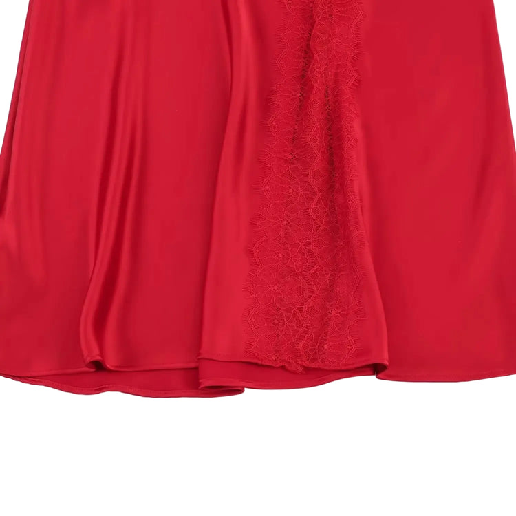 Red fabric with lace trim on a white background