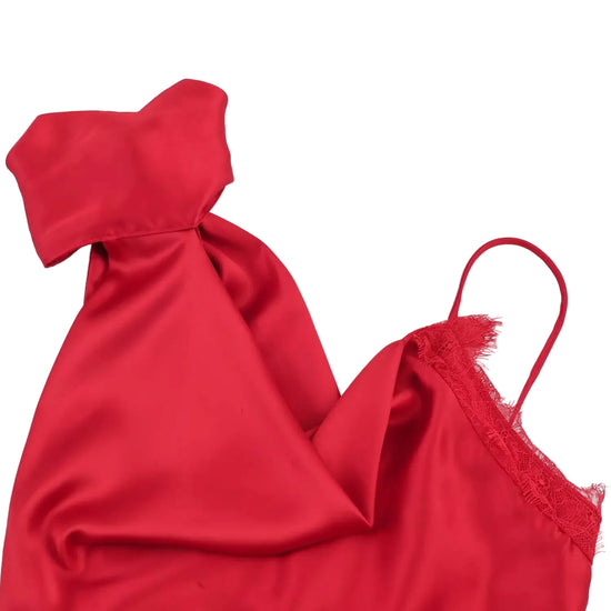 Red satin garment with lace trim on a white background