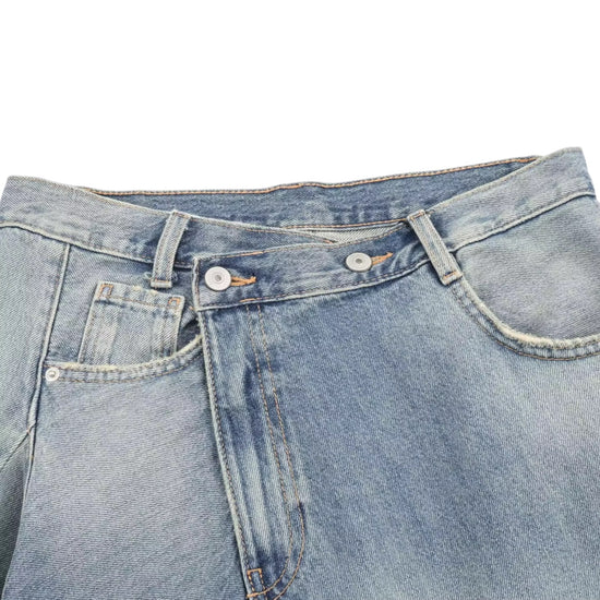 front close up Blue denim women's asymmetrical skirt on a white background